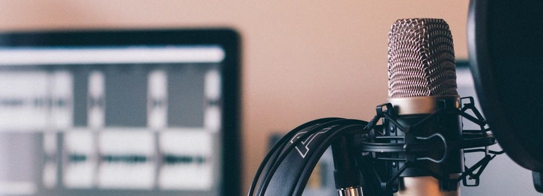 black and silver headphones on black and silver microphone