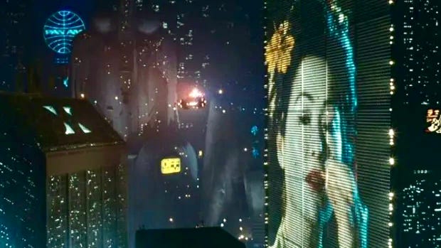 A large screen with a person on it

AI-generated content may be incorrect.
