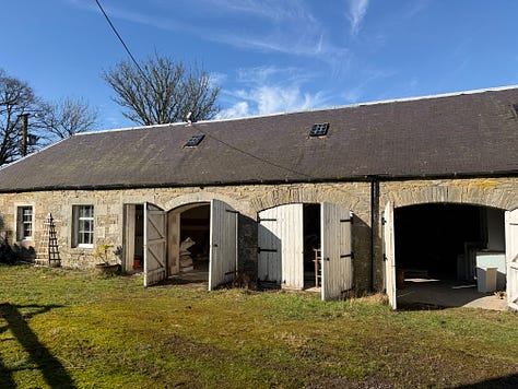 Three photos of an old barn with arched doors and light streaming in.