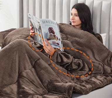 a woman is laying on a bed in a bed