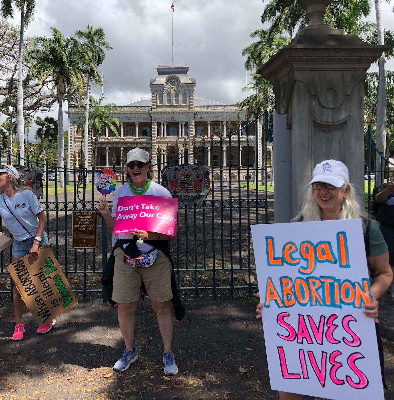 Sara holding a sign at the demonstration.