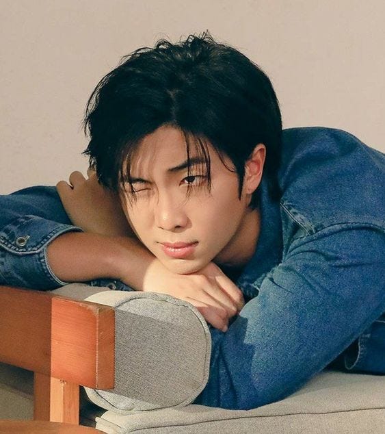 RM in denim, winking at camera. RM in a t-shirt, smiling on the beach.