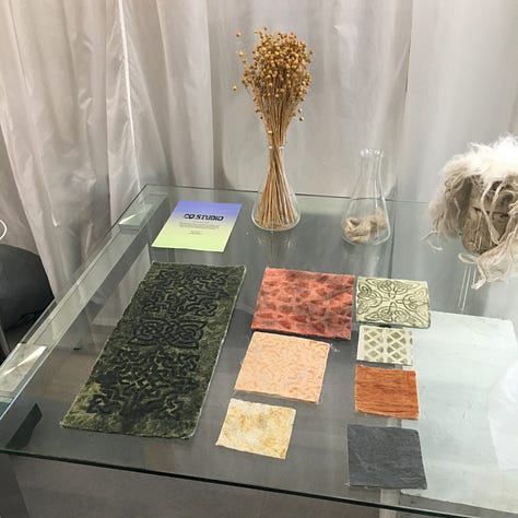 Exhibitors showing as part of the Imagining Possibilities festival at The Lab E20 — 1. Fibre information and board with ‘global fibre demand’ pie chart from The Sustainable Angle; 2. Natural fibre garments dyed with local plants from Dr. Mila Burcikova; 3. Material exploration of flax fibre from CQ Studio.