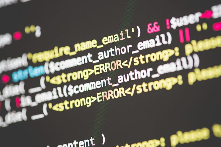 Syntax-highlighted PHP code with HTML, on dark background, in close-up view. Syntax-highlighted PHP code with HTML, on dark background, in close-up view.