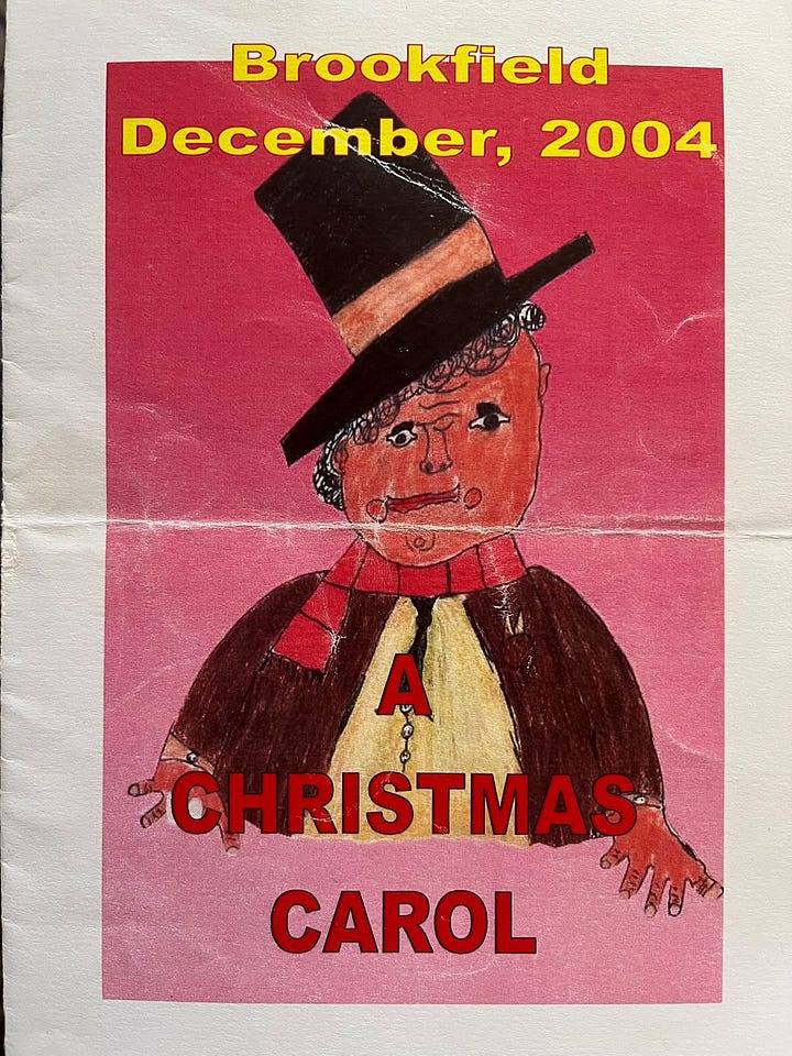 Photo of James as a young child wearing a crayola apron, next to it is a school christmas play poster.