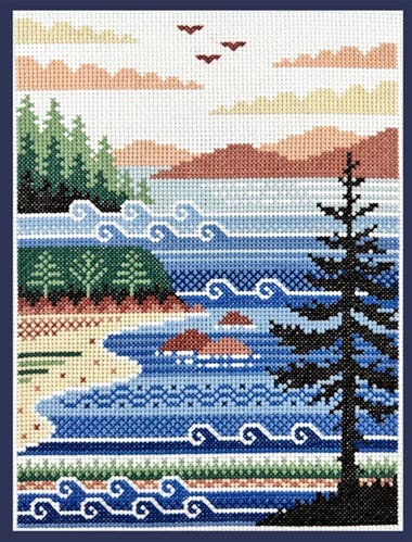 A stitched model of Atlantic Shores, Max's favorite cross stitch pattern.  The pattern shows a landscape of beach, waves, pine trees, mountains in the distance, and clouds.