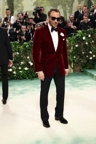 Image may contain Tom Ford Clothing Formal Wear Suit Tuxedo Blazer Coat Jacket Accessories Tie Adult and Person