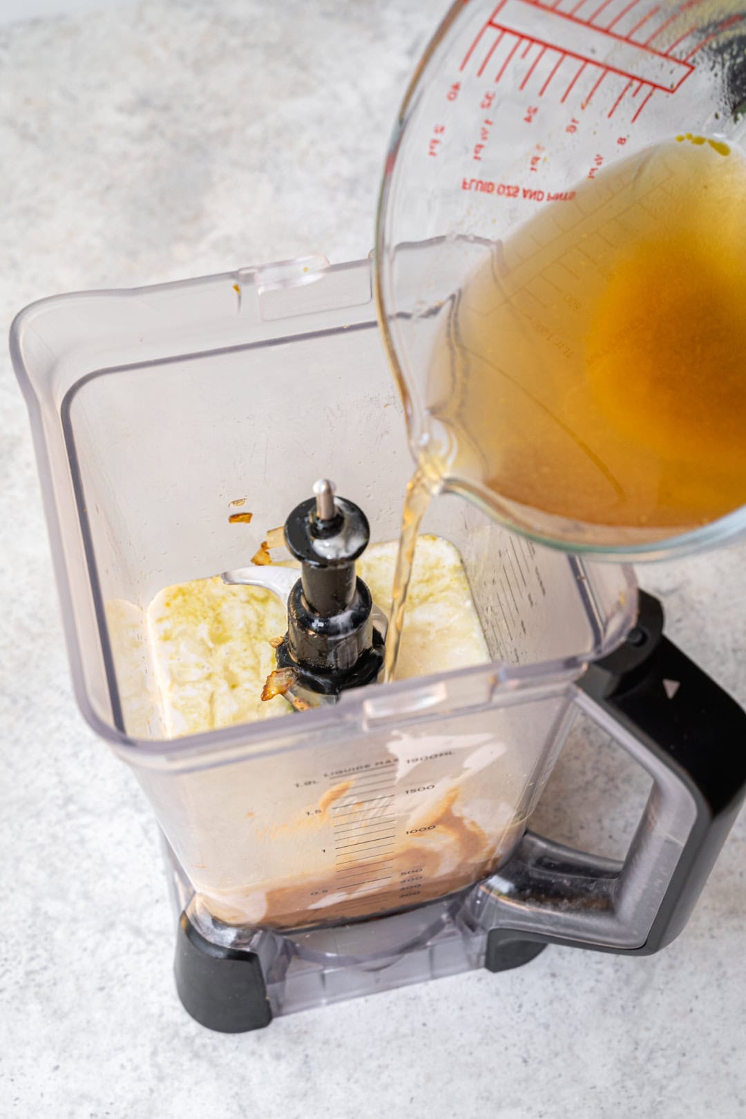 adding vegetable stock to the peanut sauce ingredients