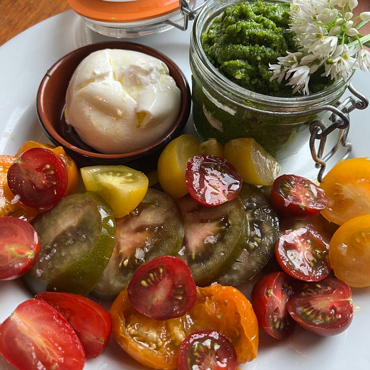 Nectarine & orange salad on vintage plate, peach & serrano ham salad with white beans & mozzarella, tomato salad with burrata & wild garlic pesto, cheeseboard with 4 cheeses, one covered in flower petals