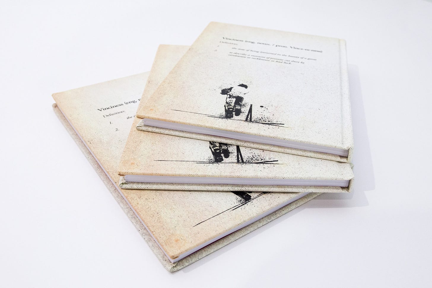 A stack of the book Vinciness by Jon Hotten. Cover design and sports artwork by Fisher Classics.