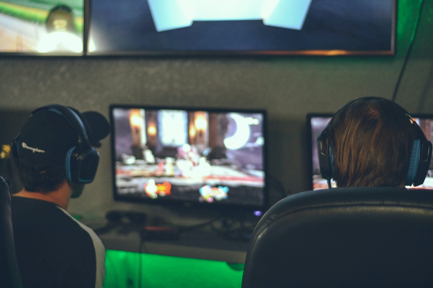 A picture of to young men playing video games
