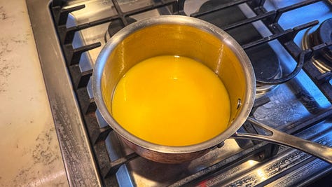 Three photos of a pot of butter cubes as they melt