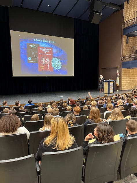 Photos of an auditorium of students, a line of students gaving books signed, and Carol behind a table at Wordsmith Bookshoppe in Knoxville IL