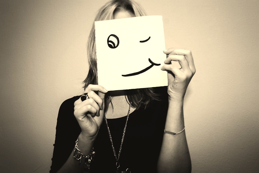 woman holding white printer paper