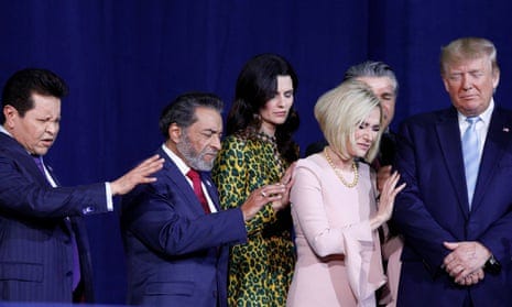Donald Trump participates in a prayer before speaking at an Evangelicals for Trump Coalition Launch at the King Jesus International Ministry in Miami, 3 January 2020. 
