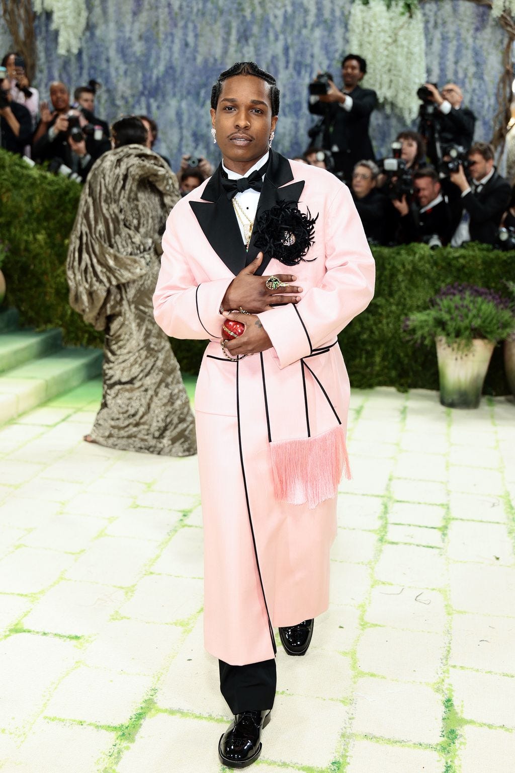 Image may contain AAP Rocky Adult Person Clothing Coat Standing and Wedding