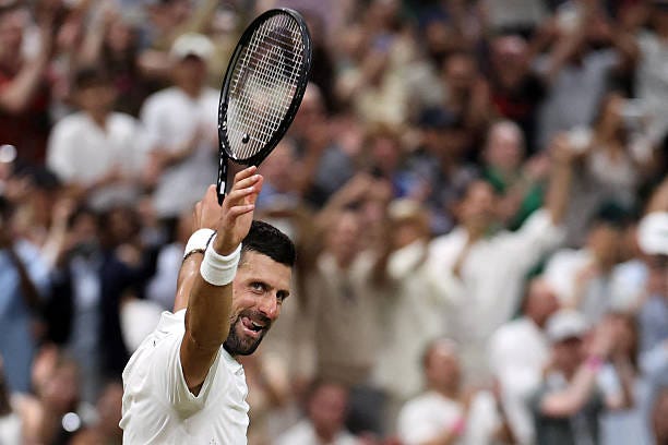 Serbia's Novak Djokovic celebrates beating Canada's Felix Auger-Aliassime during their men's singles quarter-final tennis match on the ninth day of...