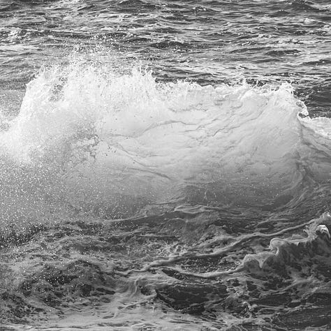 Three black and white abstraction photographs of clouds, water and lines on pavement.