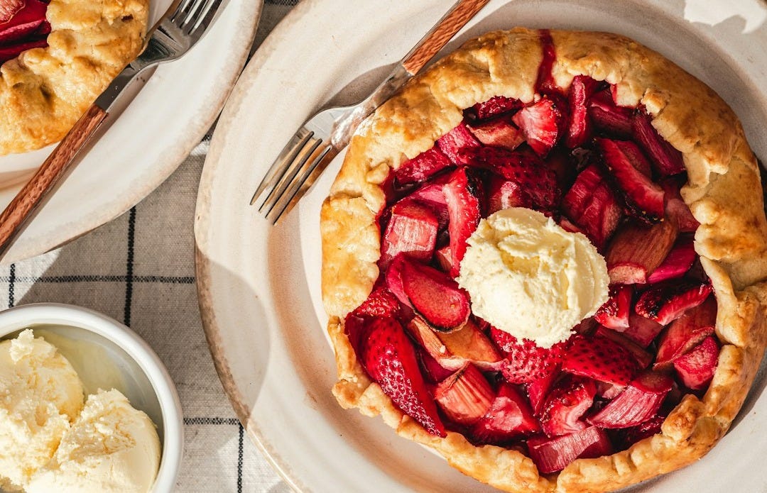 a strawberry pie with whipped cream on top a strawberry pie with whipped cream on top