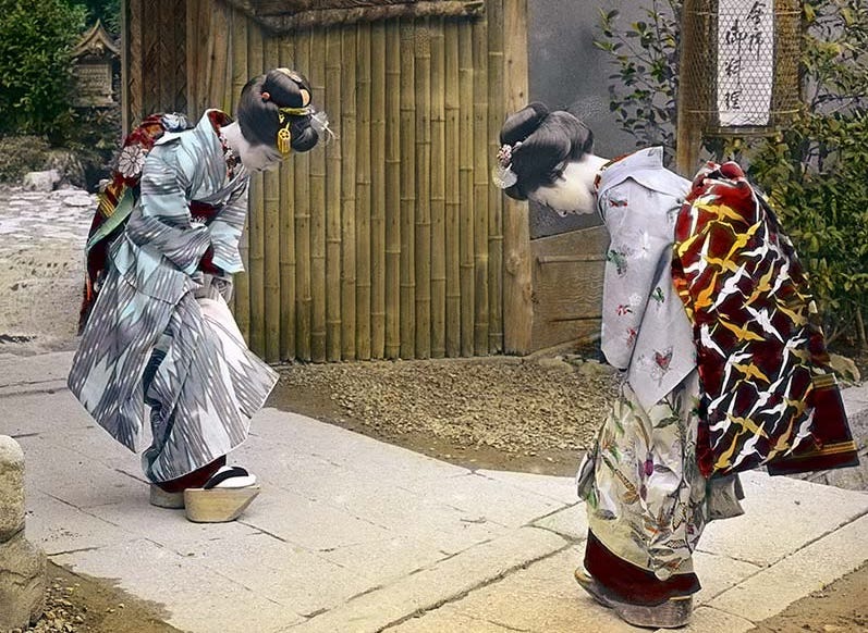 Two Japanese maiko bowing, 1890s