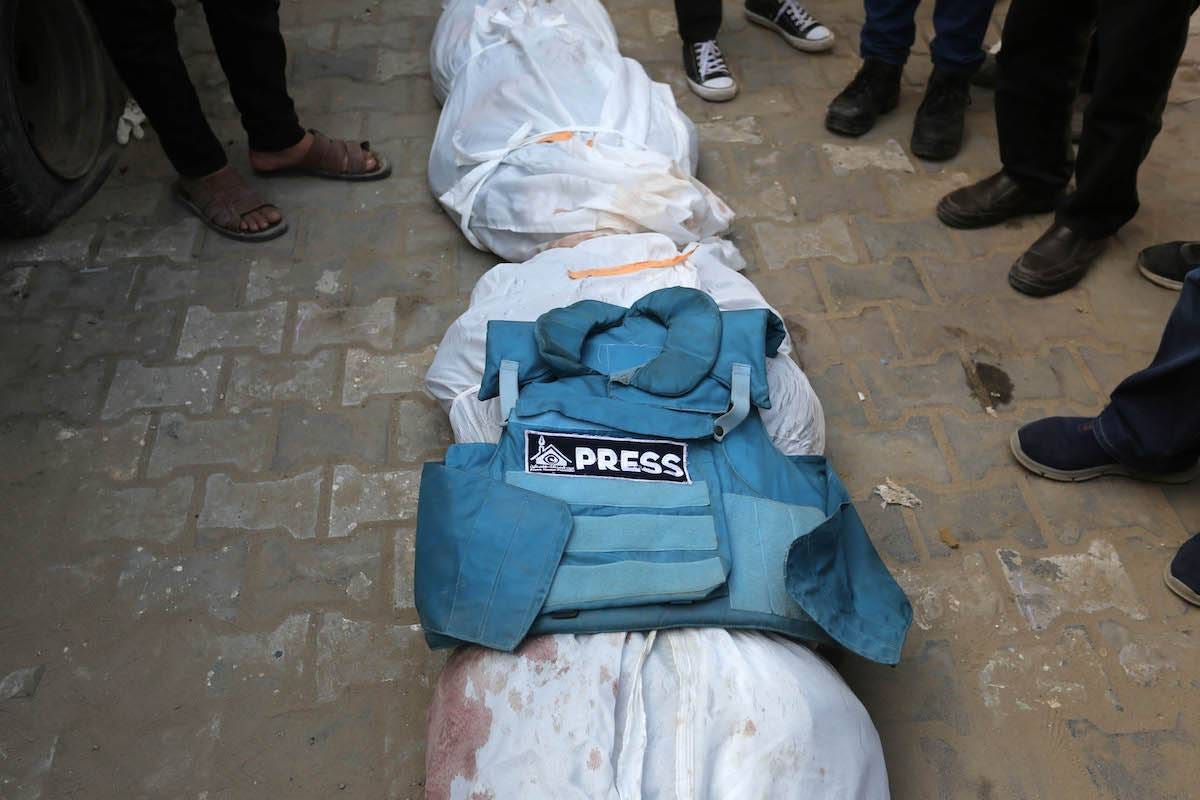 Relatives, loved ones and colleagues of Al-Aqsa TV anchor and journalist Mohammed Salamah, who was killed in an Israeli army attack on a house, attend his funeral ceremony held in front of Al-Aqsa Martyrs Hospital in Deir Al Balah of Gaza on March 06, 2024 [Ashraf Amra - Anadolu Agency]