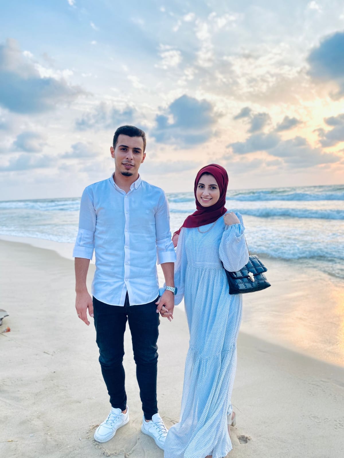 a Palestinian couple on a beach in Gaza