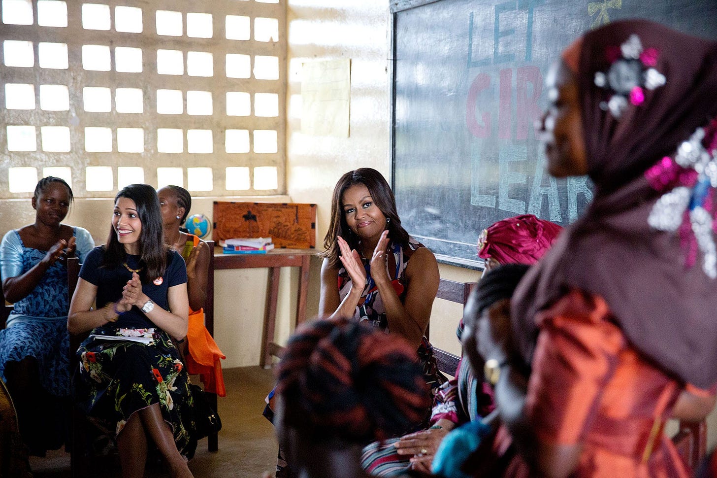 June 27, 2016: Bathed in beautiful light, First Lady Michelle Obama participates in a roundtable discussion with Liberian President Ellen Johnson Sirleaf and Freida Pinto, supporting the 'Let Girls Learn' initiative in Liberia. June 27, 2016: Bathed in beautiful light, First Lady Michelle Obama participates in a roundtable discussion with Liberian President Ellen Johnson Sirleaf and Freida Pinto, supporting the 'Let Girls Learn' initiative in Liberia.