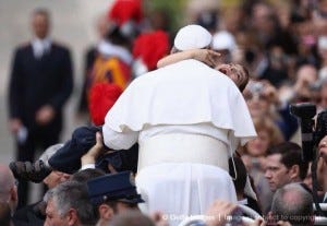 Pope Francis hugs Dominic Gondreau at Easter Mass.