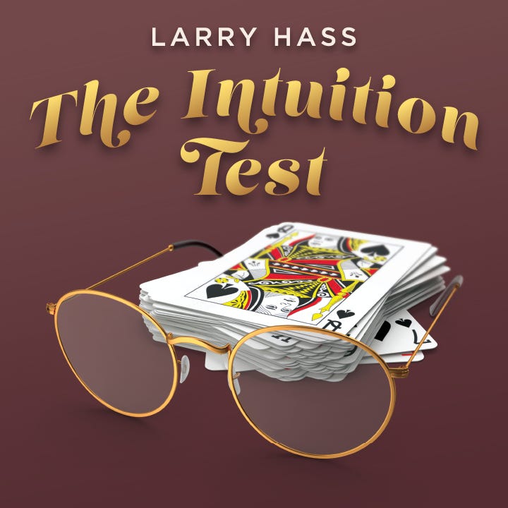 A face-up deck of playing cards behind a pair of metal-rimmed spectacles.