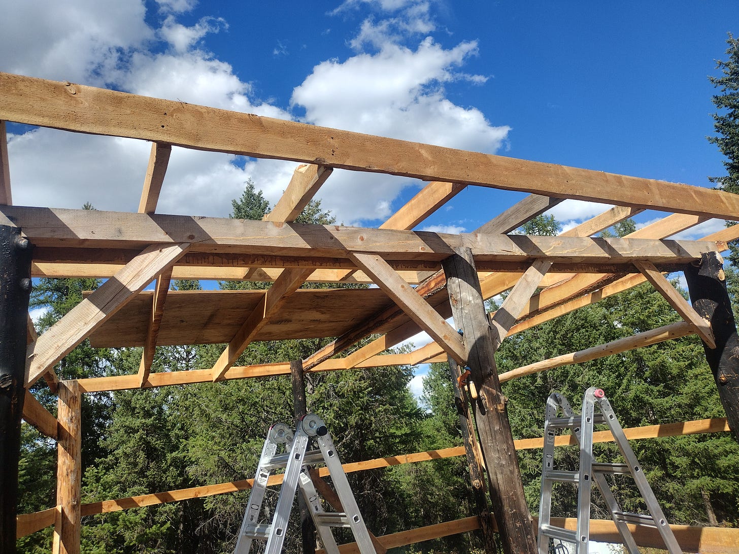 The building frame with the roof riser frame laying atop it.