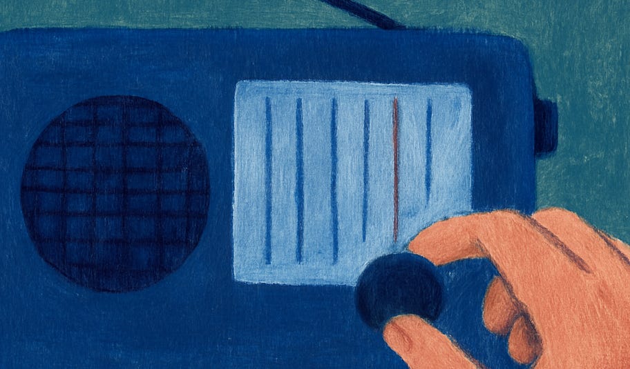 man tuning a radio