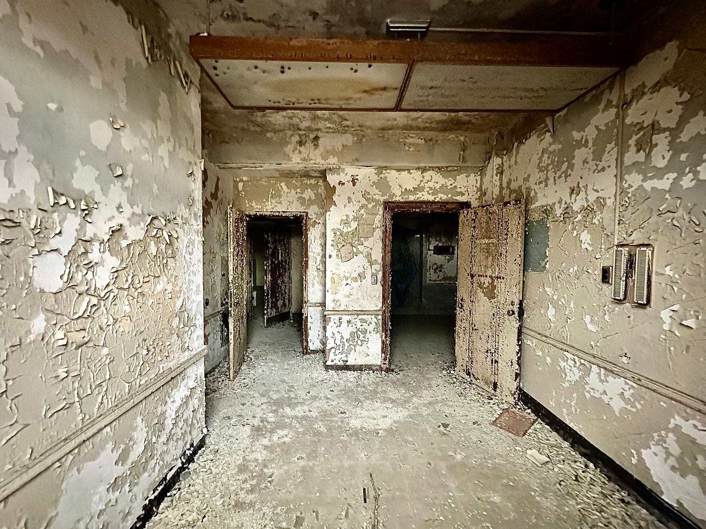Abandoned hallways inside a Central State Hospital Building. Abandoned hallways inside a Central State Hospital Building.