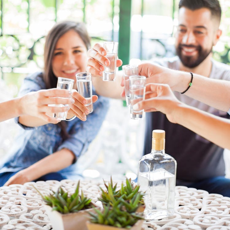 Writers doing tequila shots. Writers doing tequila shots.