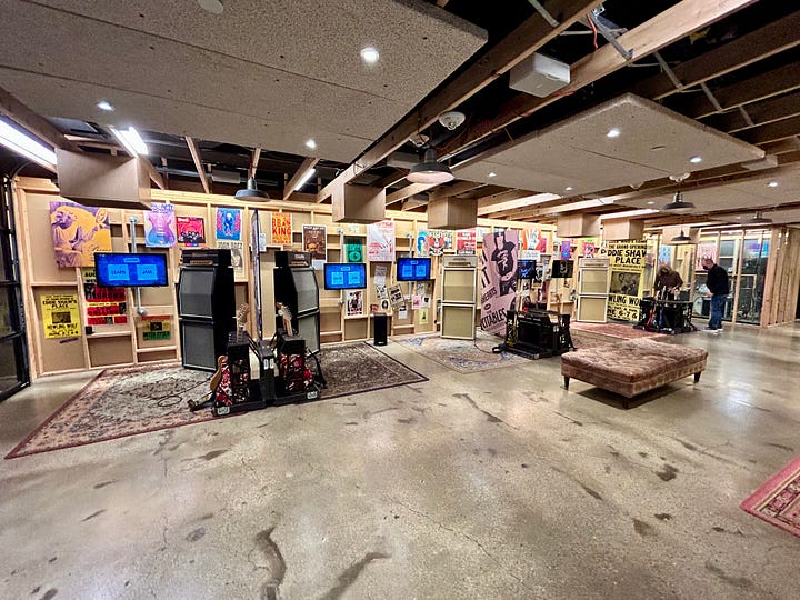 guitars, instruments, couch, lights, floor, door