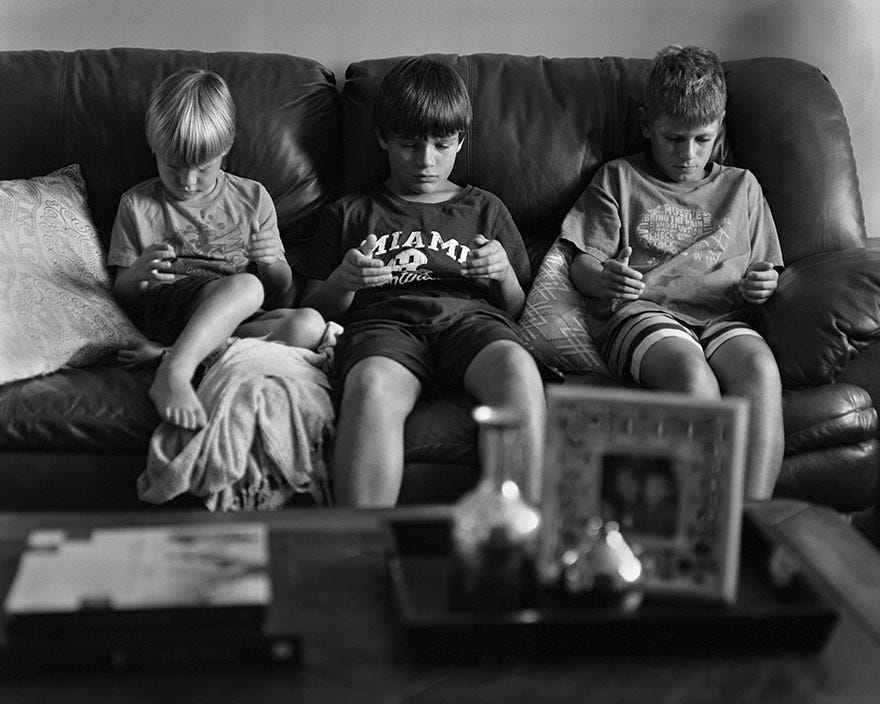 Removed: Photographer Removes Phones From His Photos To Show How Terribly Addicted We've Become