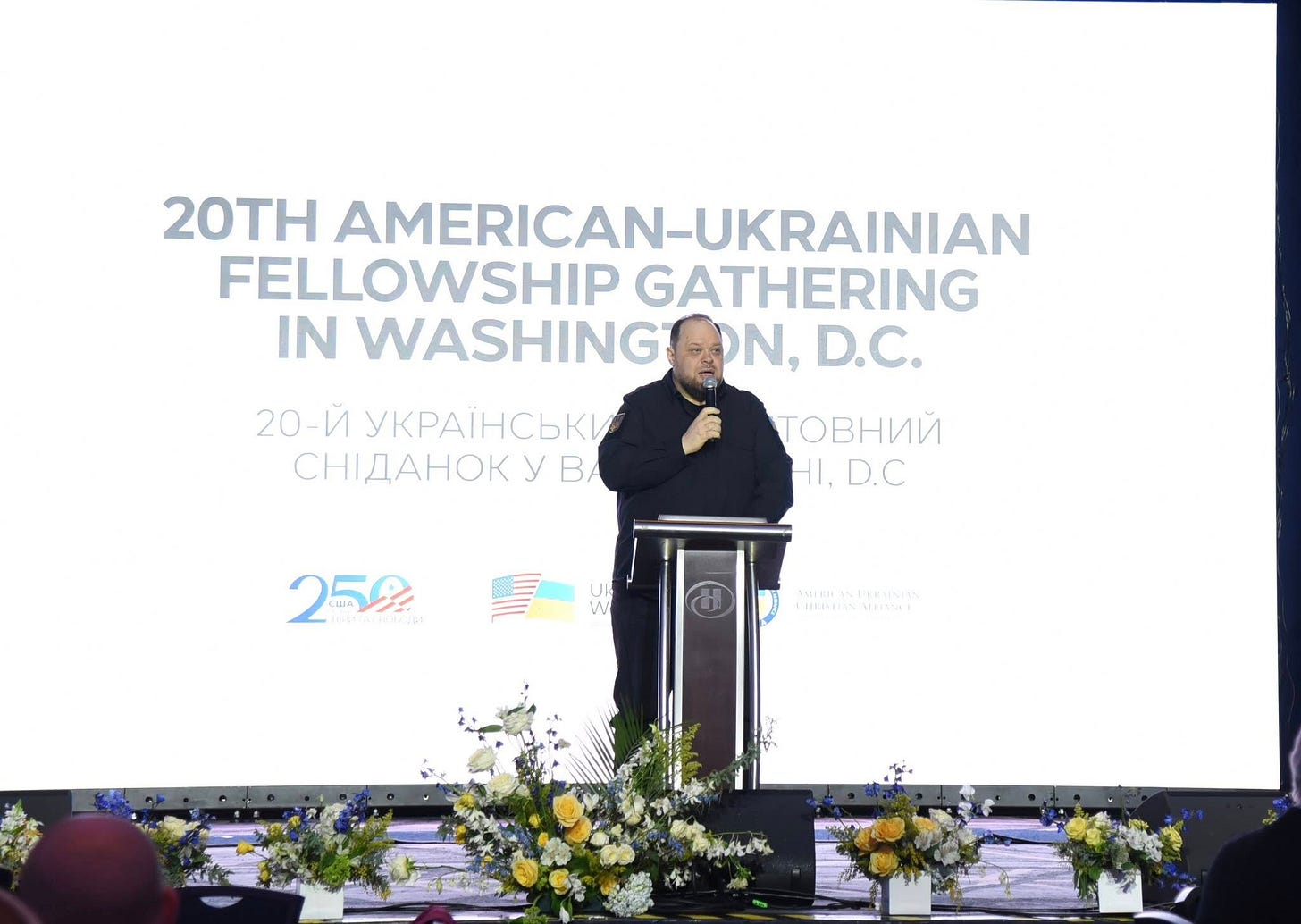 На зображенні може бути: поміст та текст «20TH AMERICAN-UKRAINIAN -UKRAINIAN FELLOWSHIP GATHERING IN WASHING DN, D.C. 20-Й yKPAΪHCbKИ CHИAAHOK yB TOBHиЙ HI.D.C HI. D.C 252 MoCkastonccm nHo NeusMulen»