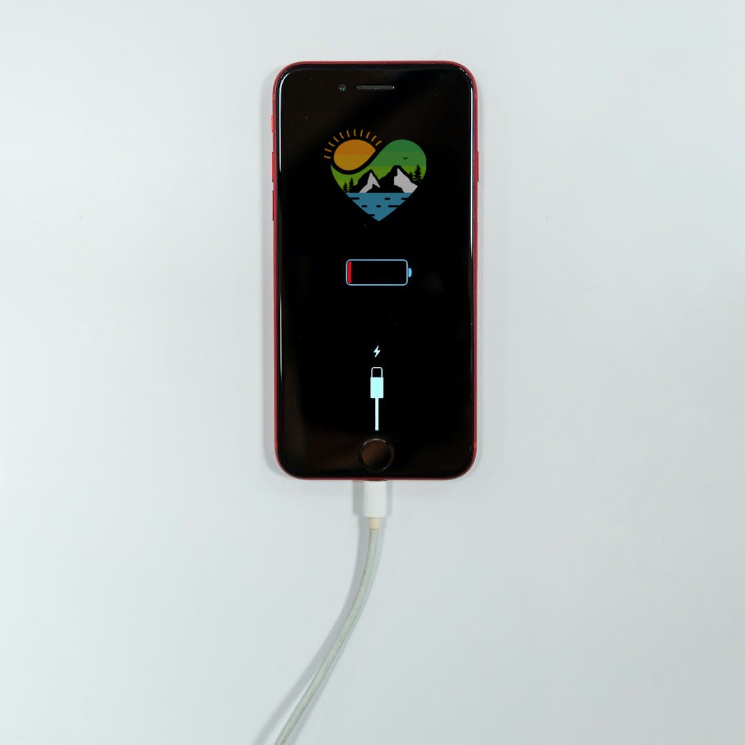 black iphone 5 on white surface