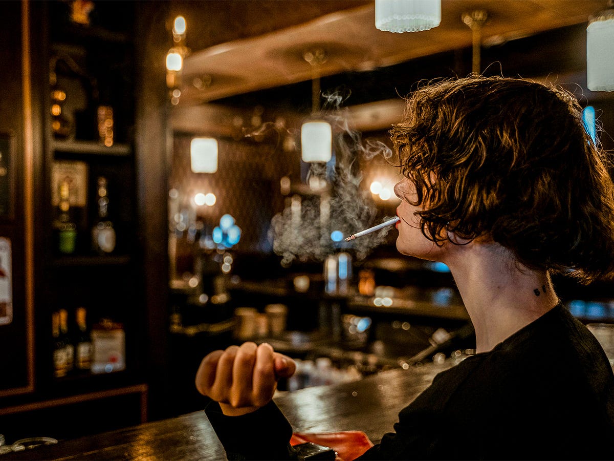 Girl Smoking in Tavern