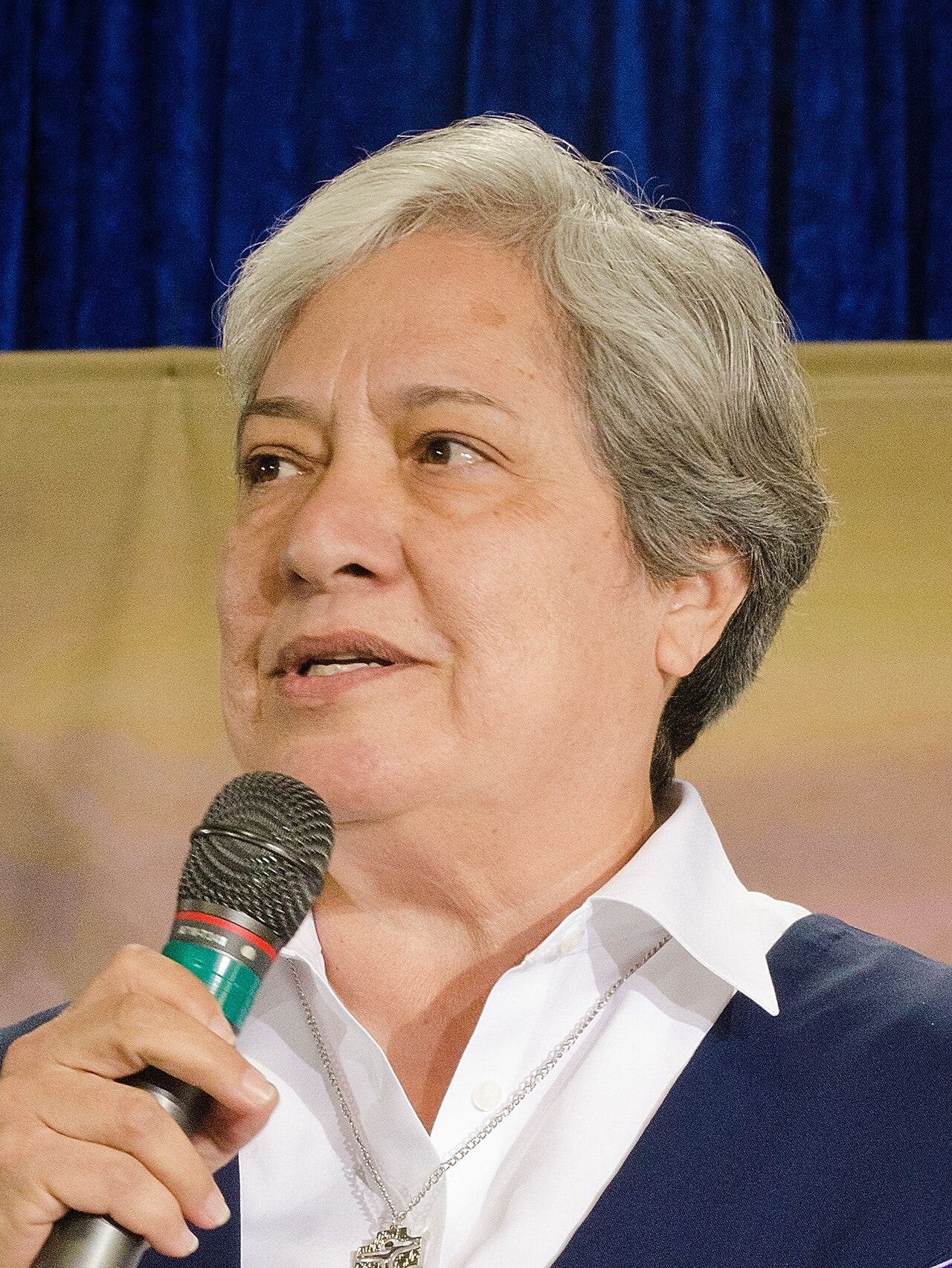 Sister Norma Pimentel speaking into a microphone Sister Norma Pimentel speaking into a microphone