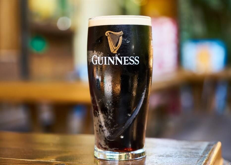 The History and Symbolism of the Guinness Logo - Free Logo Design