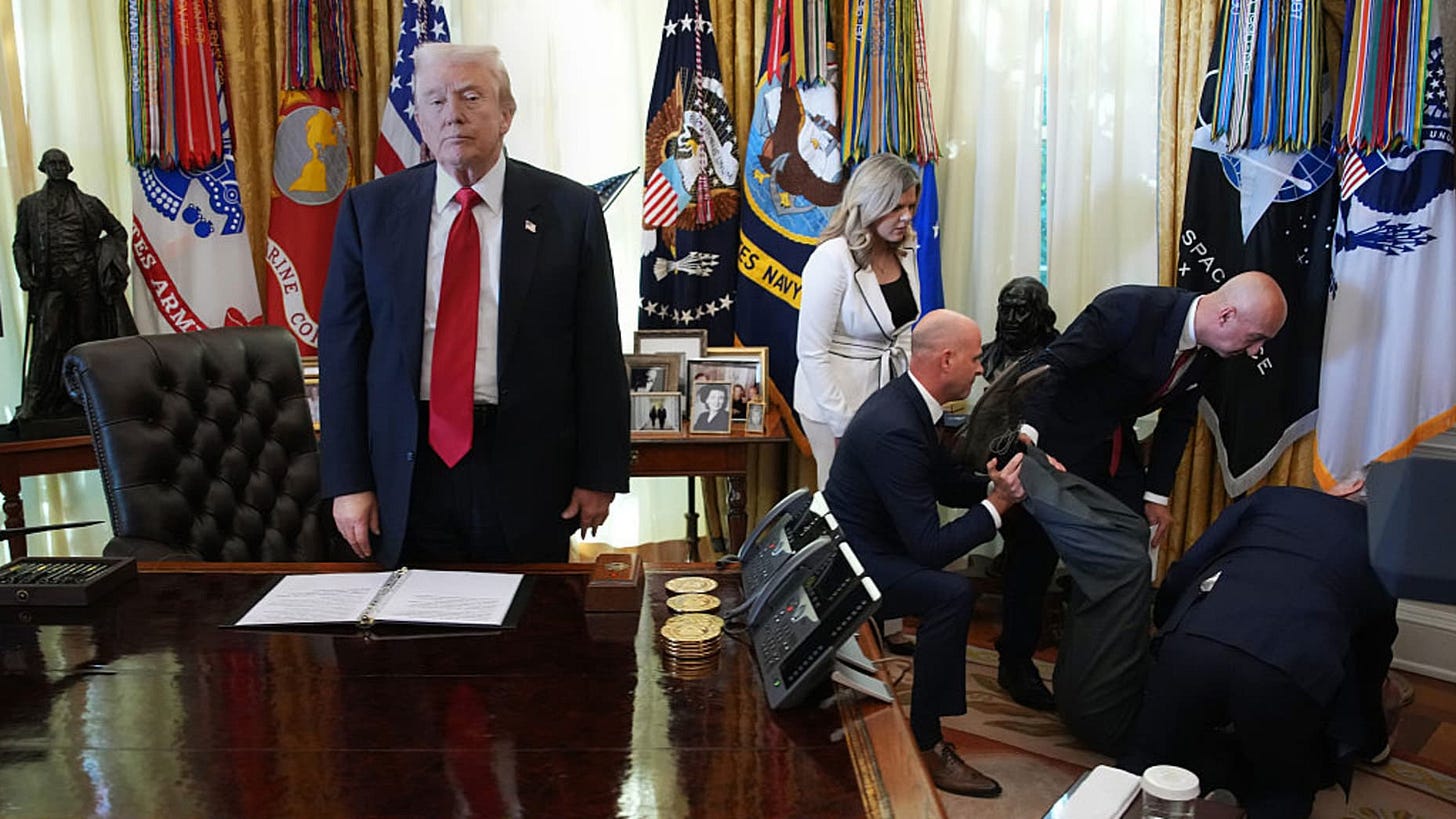WASHINGTON, DC - NOVEMBER 06: U.S. President Donald Trump stands by as attendees help Novo Nordisk executive Gordon Findlay after he collapsed during during an event on lowering drug prices in the Oval Office at the White House on November 06, 2025 in Washington, DC. Trump announced that his administration has reached agreements with drugmakers Eli Lilly and Novo Nordisk that would lower the price of some GLP-1 weight loss medications. (Photo by Andrew Harnik/Getty Images)