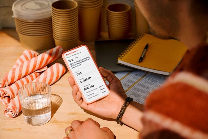 A Phone shows a DoorDash Ads dashboard A Phone shows a DoorDash Ads dashboard