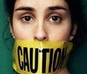 A person with tape over her mouth

AI-generated content may be incorrect.