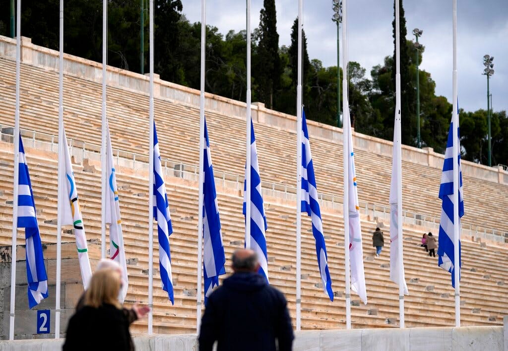 Greek and Olympic flags at half-staff as the Hellenic Olympic Committee commemorates Constantine II, the former king of Greece who was an Olympic sailing gold medalist at Rome in 1960, at Panathinean stadium, Athens, January 11, 2023. 