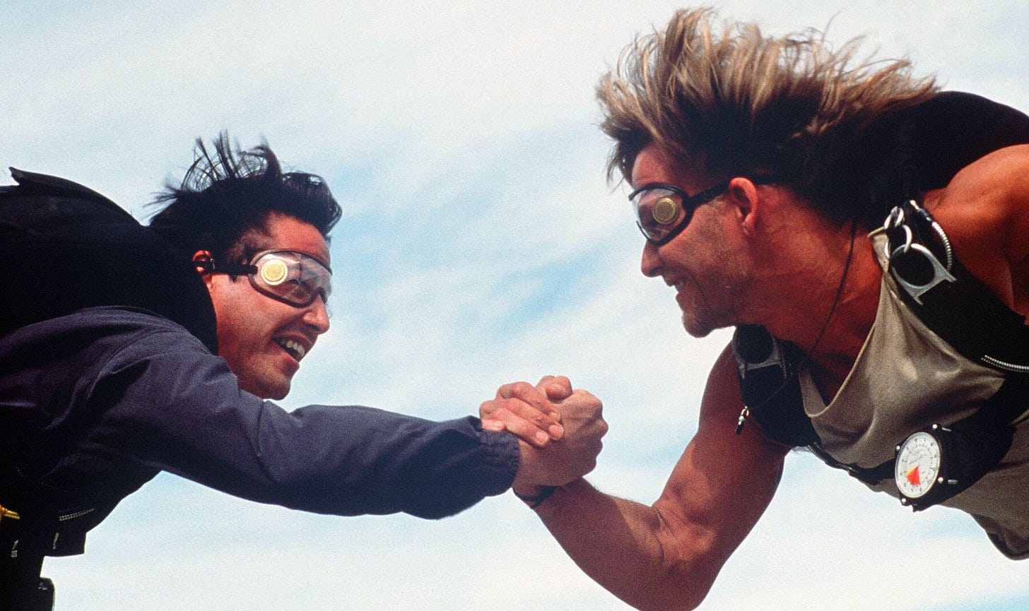 point break skydiving high five