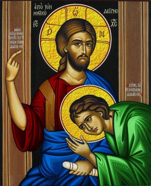 This may contain: an icon of jesus holding the baby jesus