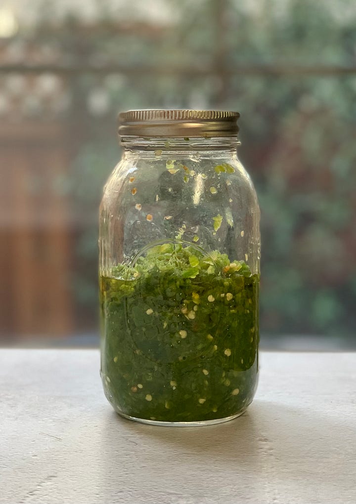 Two jars of shatta, one made from Fresno peppers and one made from jalapeno peppers.