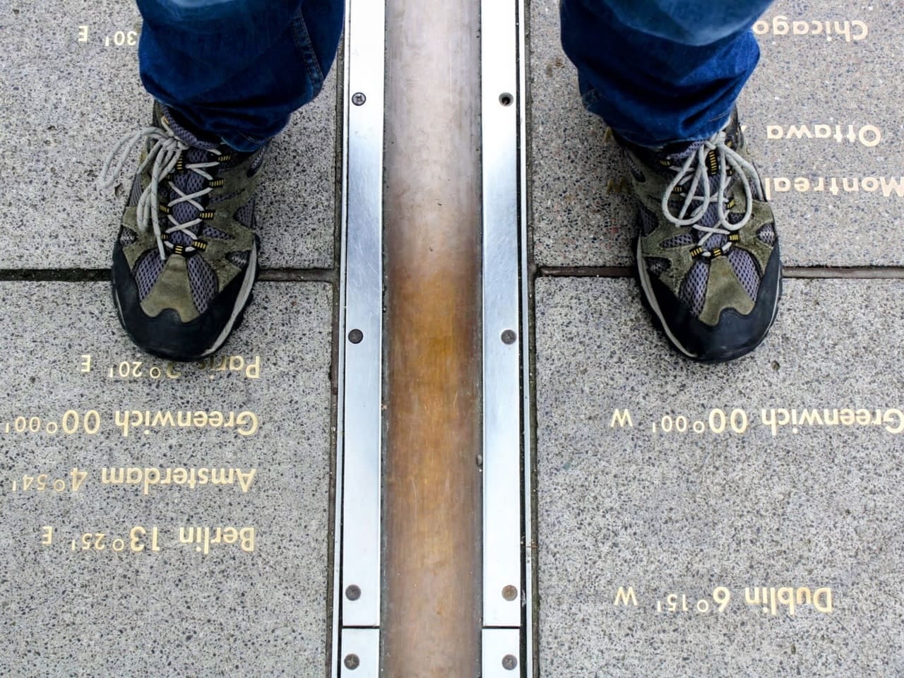 A moment in time standing on the Greenwich meridian A moment in time standing on the Greenwich meridian