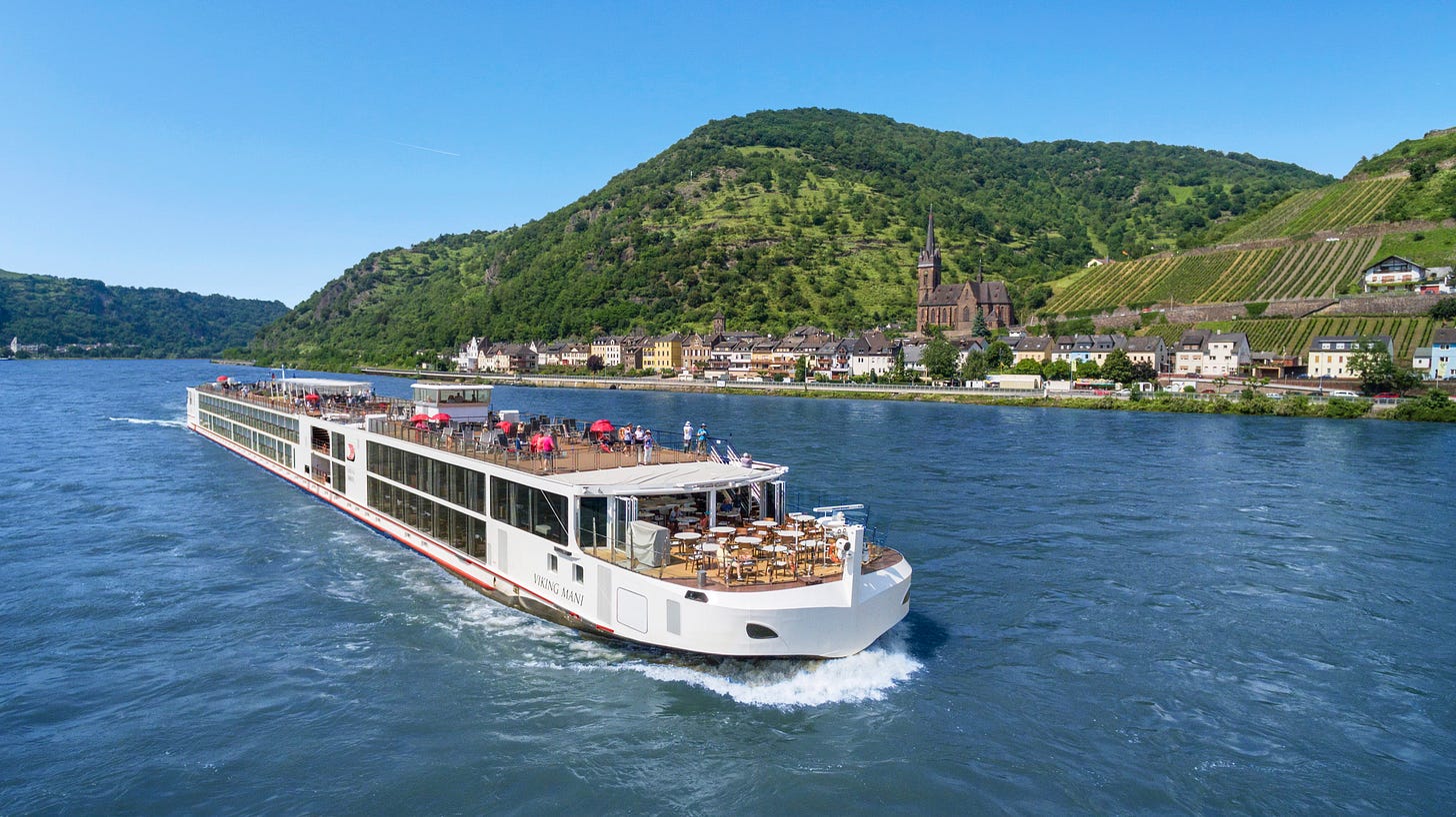 Viking Longship navigating a European river, showcasing the vessel's design for intimate river cruising. Viking Longship navigating a European river, showcasing the vessel's design for intimate river cruising.