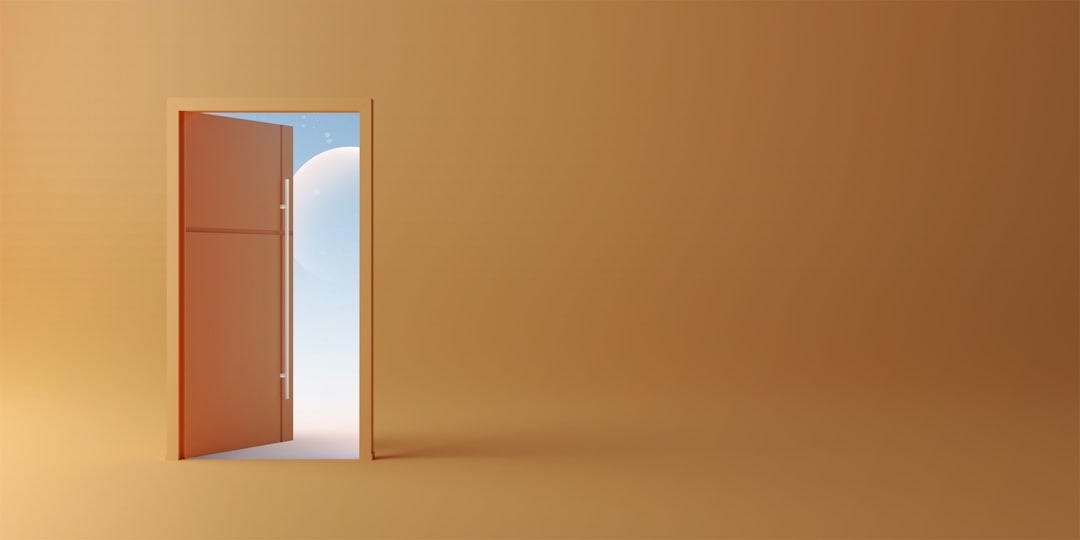 an open door leading to a bright orange room an open door leading to a bright orange room